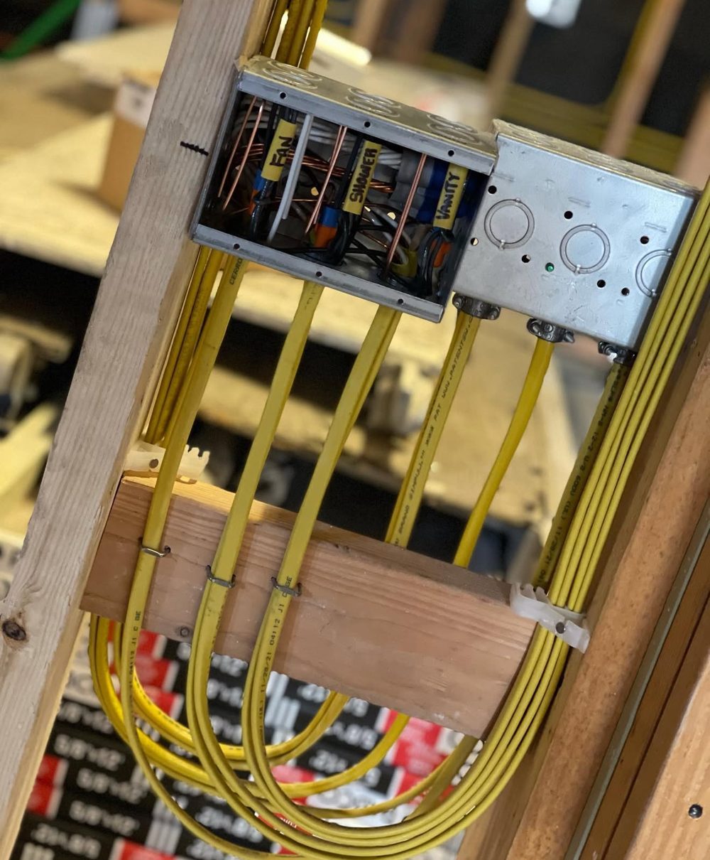 Bathroom switch box with fan, shower and vanity circuits labeled